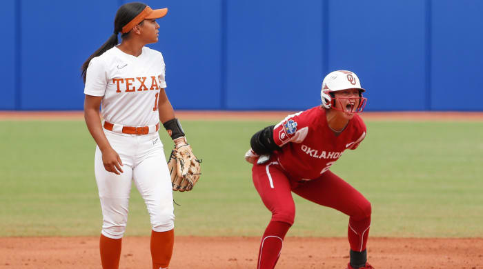 Oklahoma’s Jayda Coleman celebrates after reaching second base during a Women’s College World Series game vs. Texas